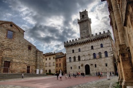 a group of people standing in front of a castle