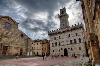 a group of people standing in front of a castle