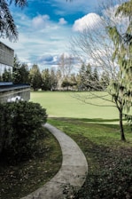 a path leading to a building in a park