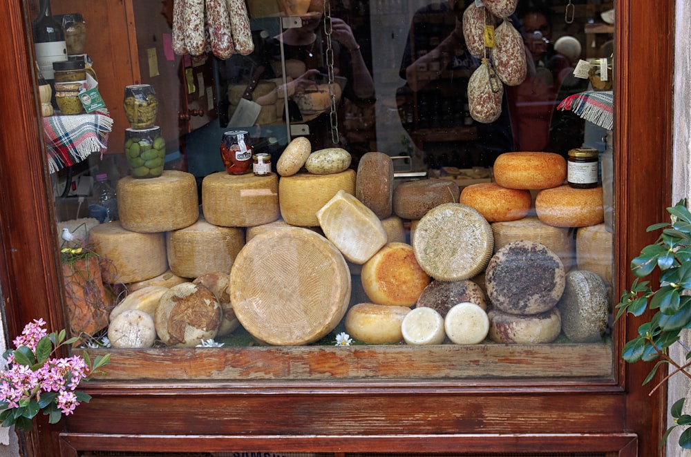 a display of cheeses in a store window
