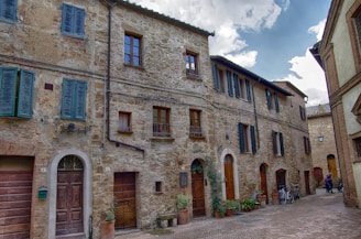 a cobblestone street lined with stone buildings