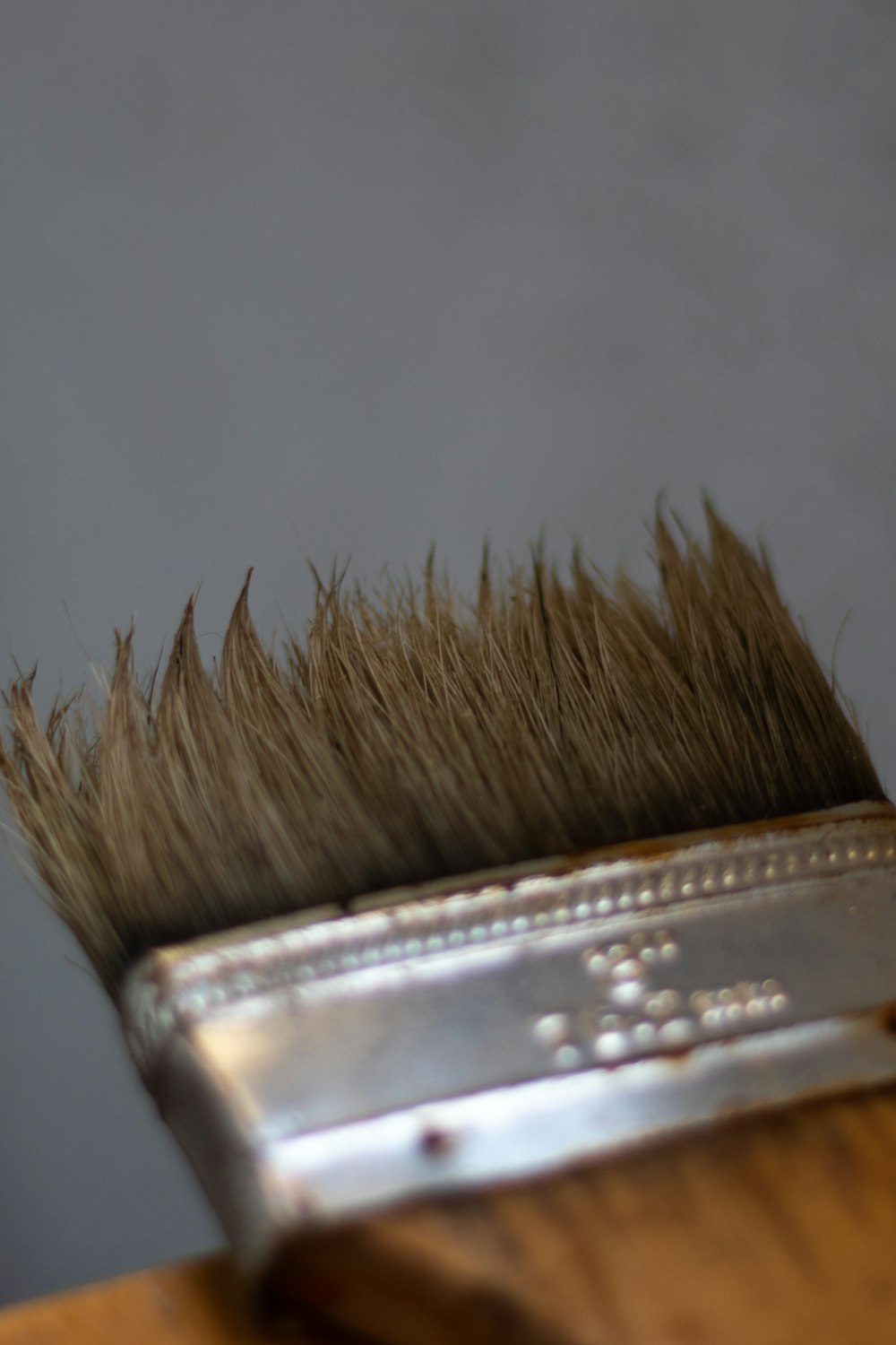 a close up of a brush on a table