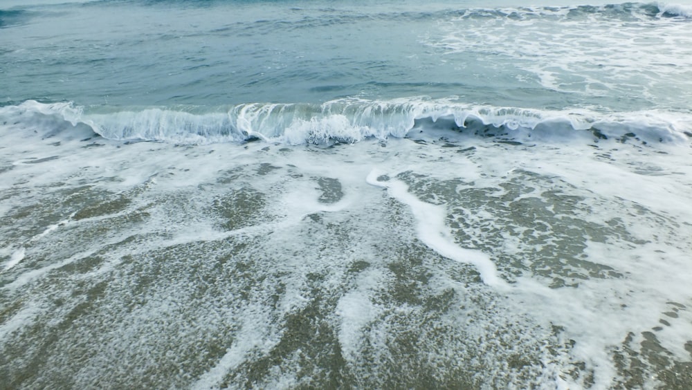 a view of the ocean from above the waves