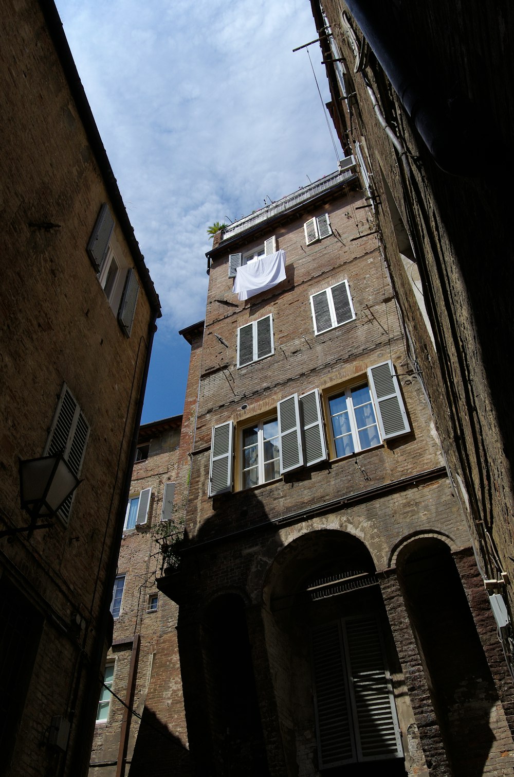 a tall brick building with lots of windows