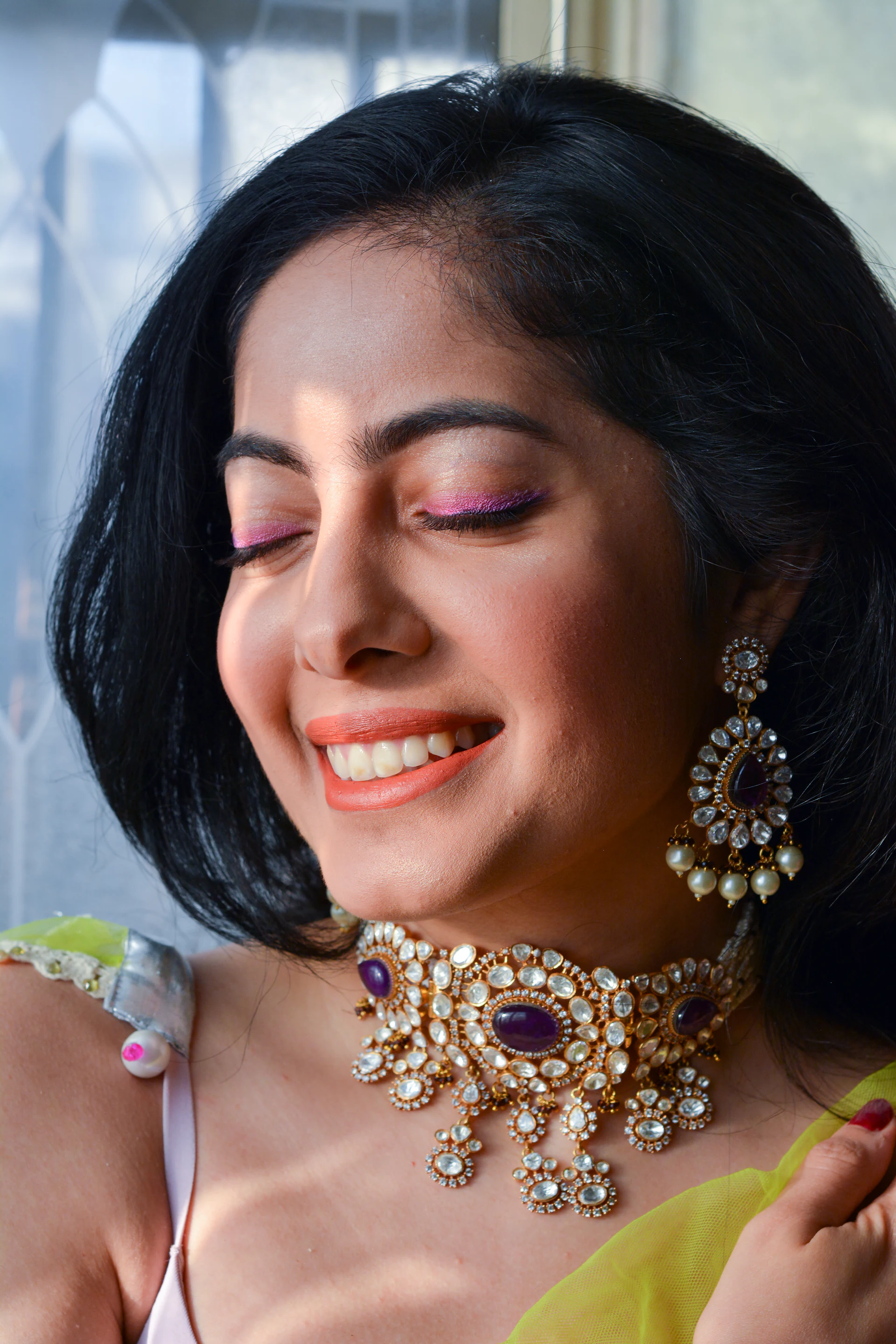 Smiling woman in a kundan choker necklace
