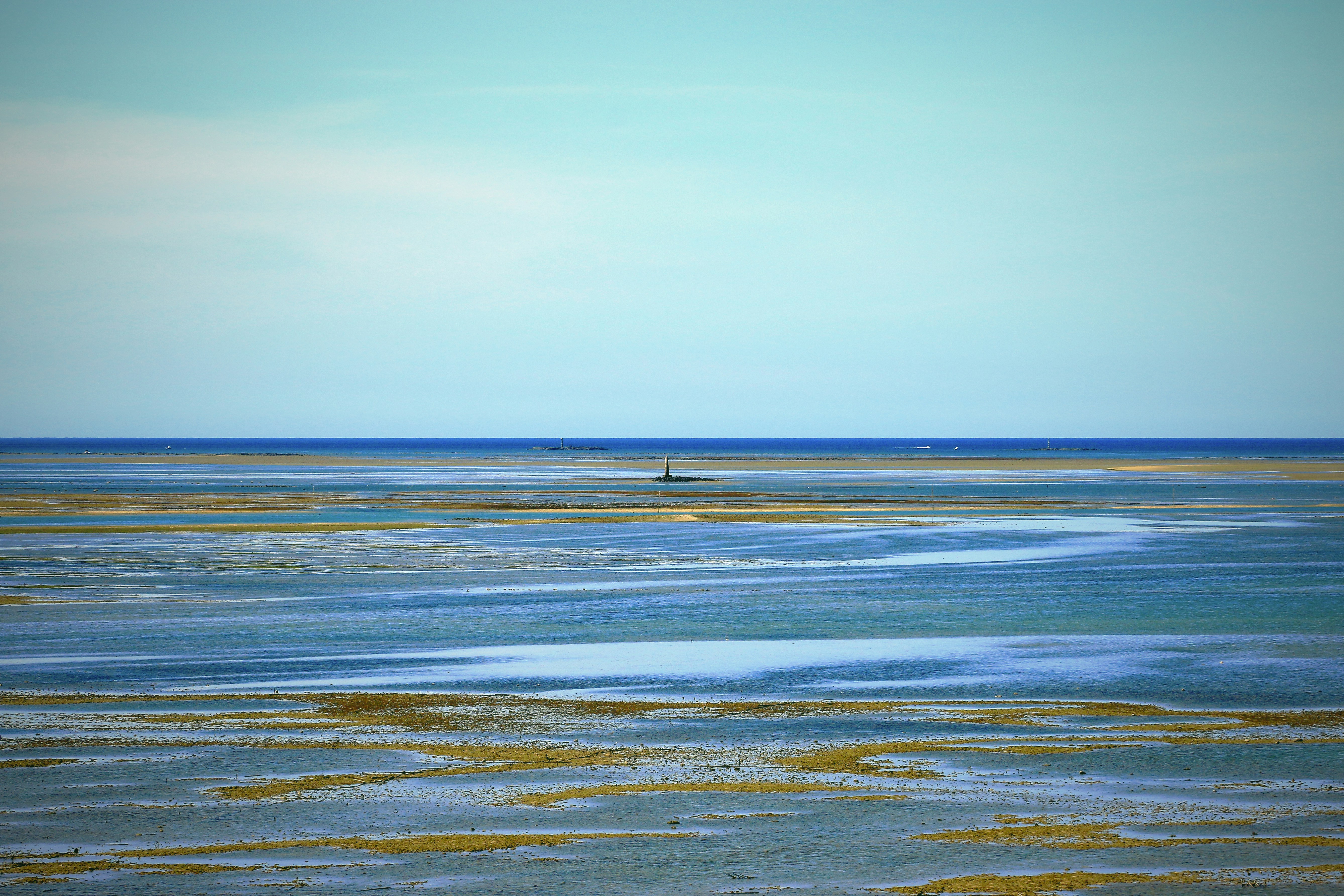 a person riding a surfboard on a large body of water