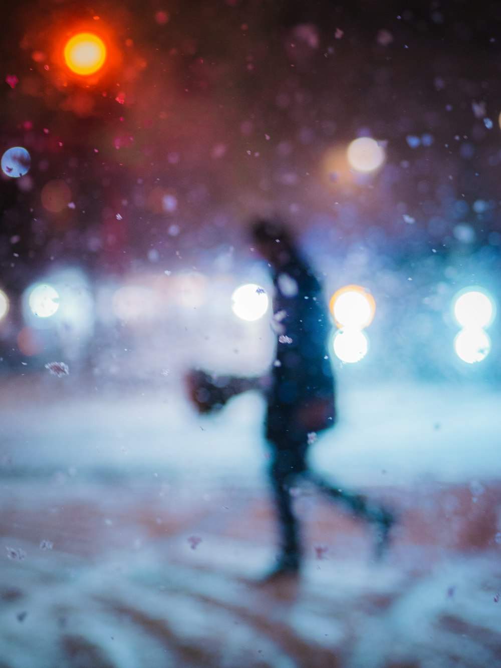 a blurry photo of a person walking down a street