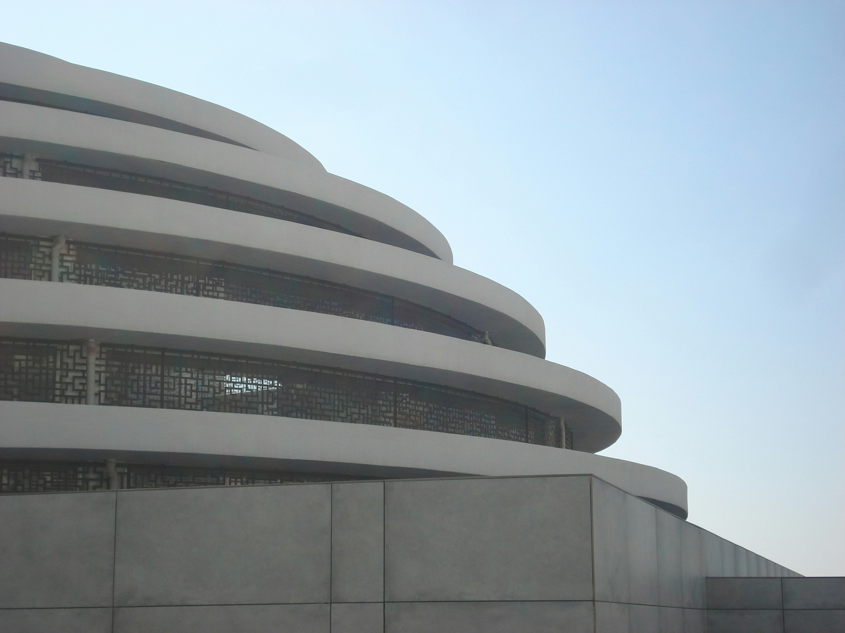 a large building with a lot of windows on top of it