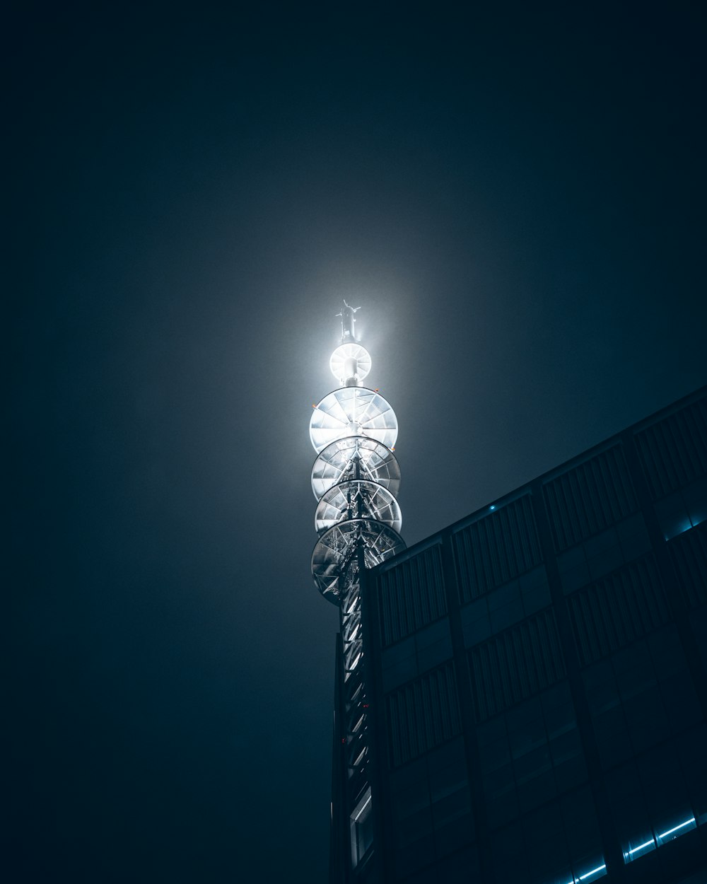 a tall tower with a light on top of it