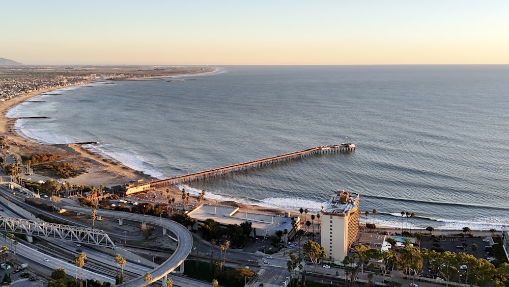 an aerial view of a beach and a pier