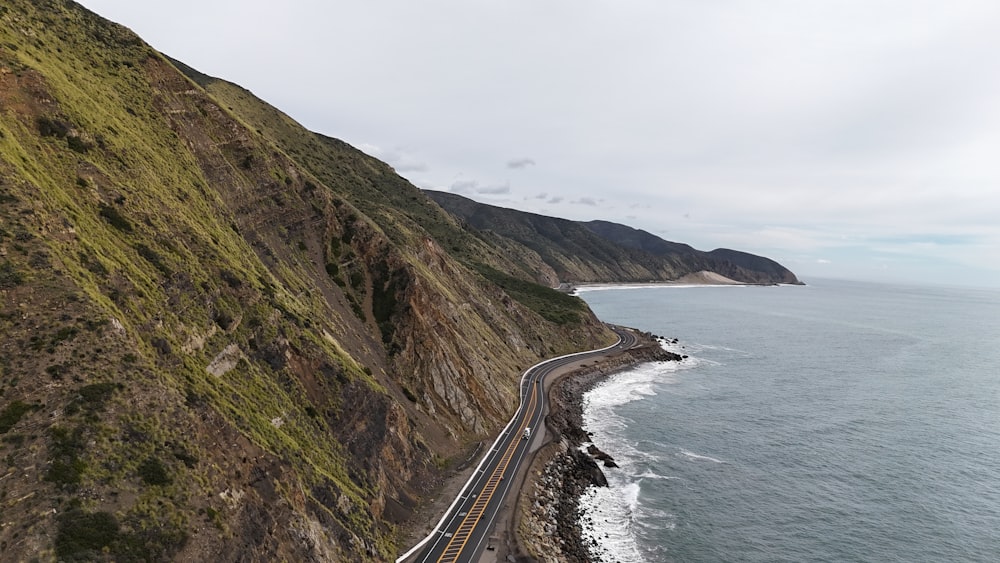 a view of the ocean from the top of a hill