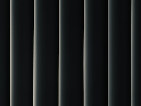 a black and white photo of a curtain