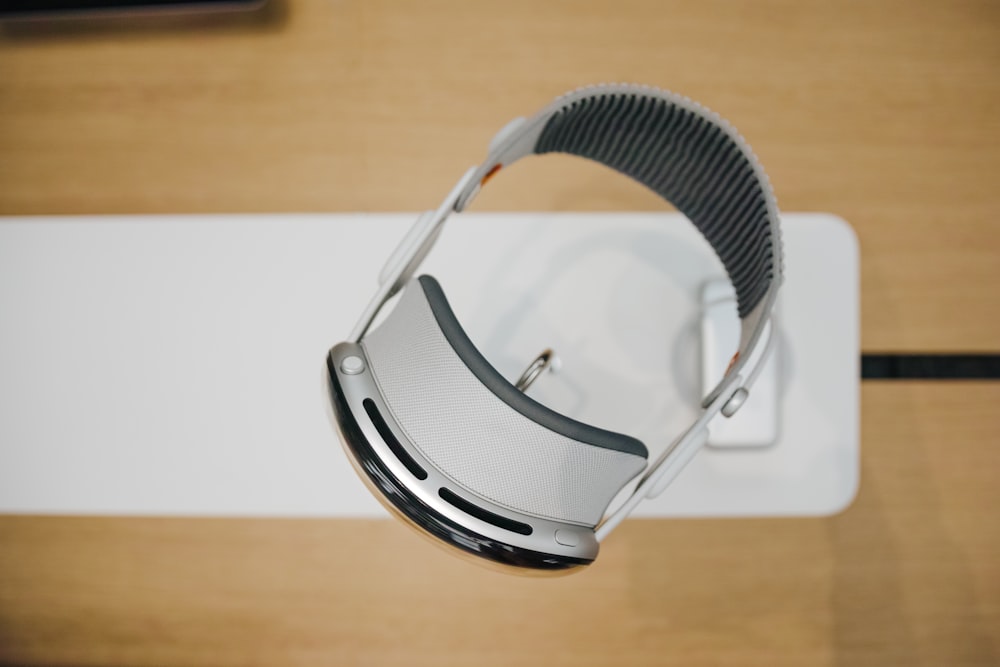 a pair of headphones sitting on top of a wooden table