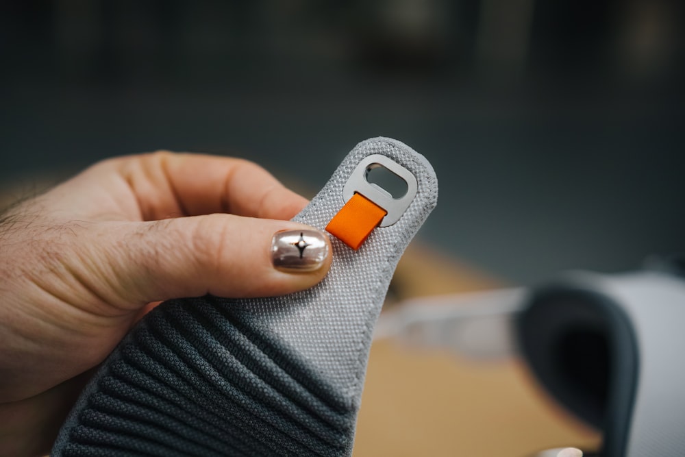 a close up of a person holding a cell phone