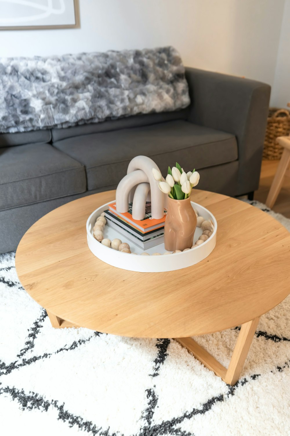 a living room with a gray couch and a coffee table