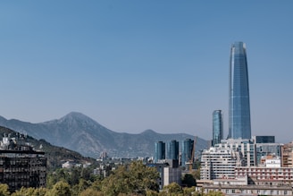 a view of a city with mountains in the background