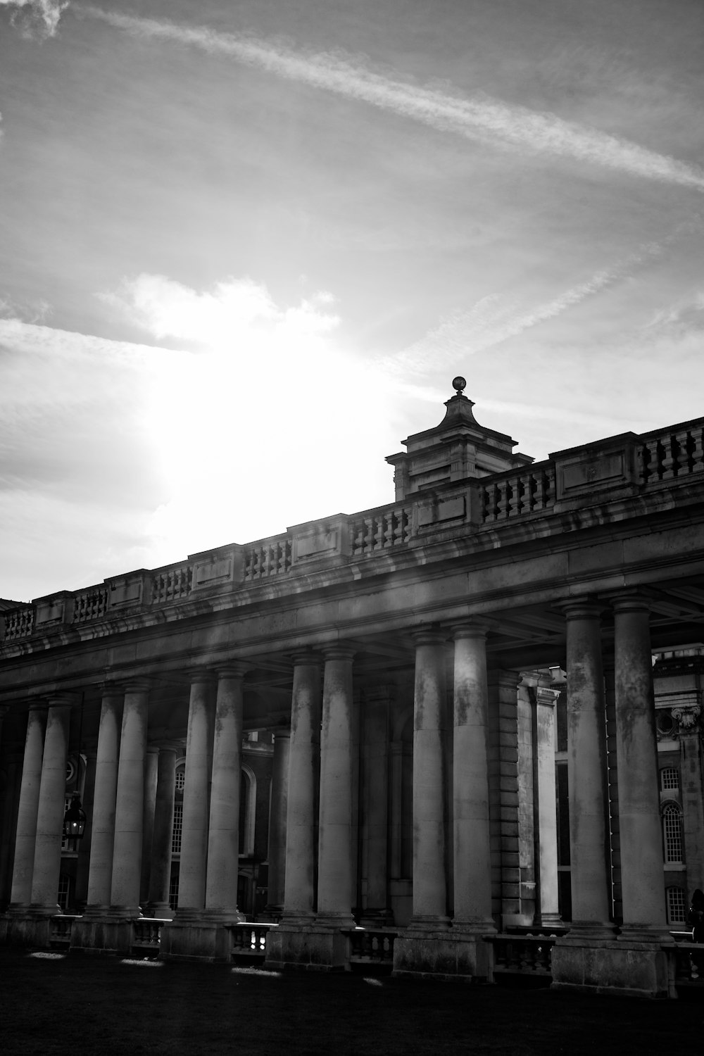 a black and white photo of a building with columns