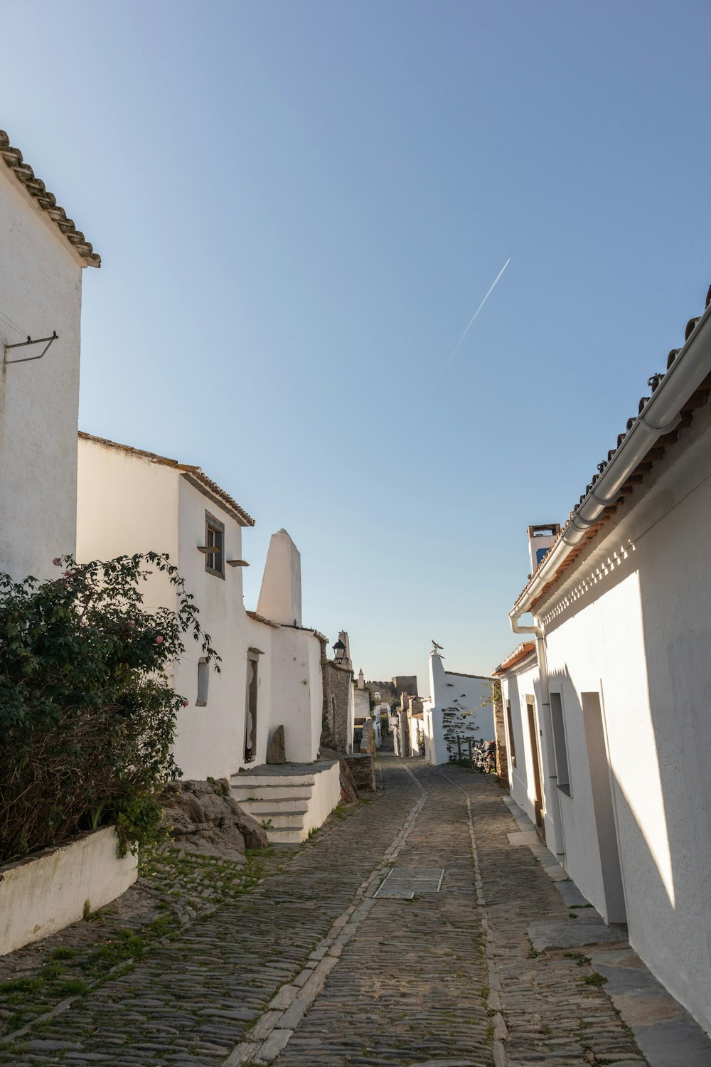 a cobblestone street in a small village