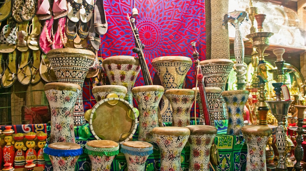 many different colored vases are on display in a store