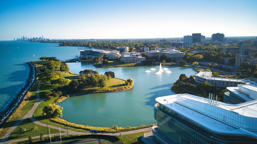 an aerial view of a city and a lake