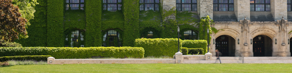 a large building with a lawn in front of it