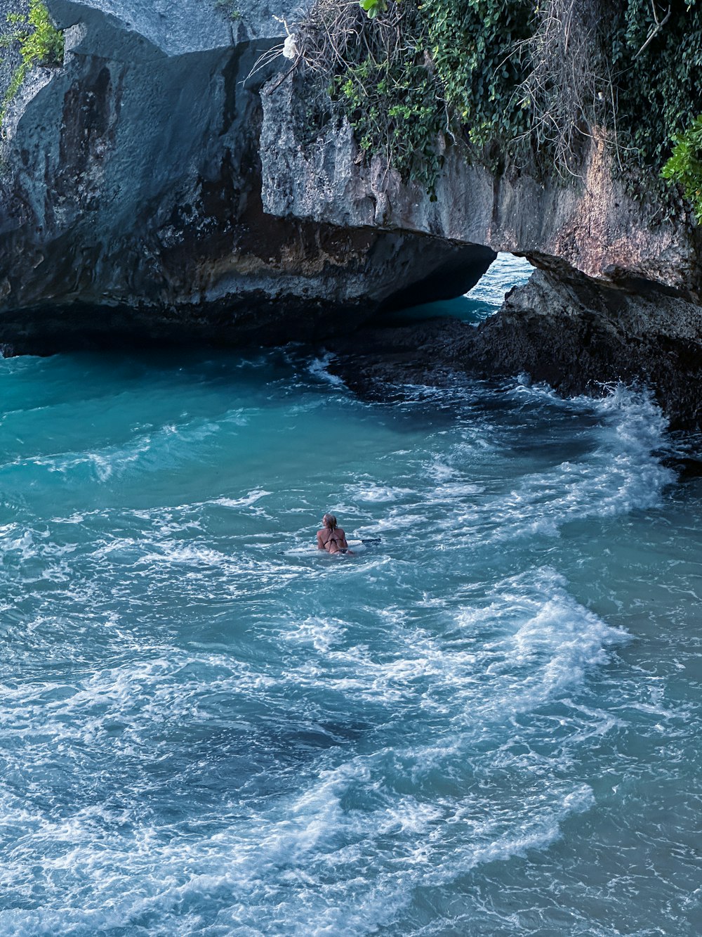 a person swimming in a body of water