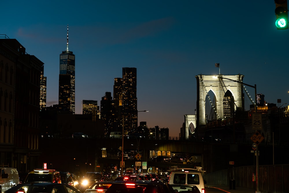 a city street filled with lots of traffic at night