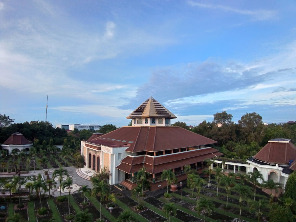 an aerial view of a building surrounded by trees