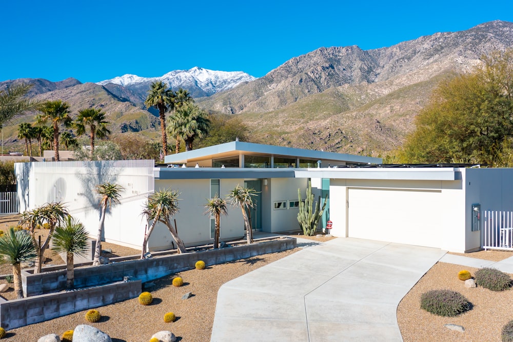 a house with mountains in the background