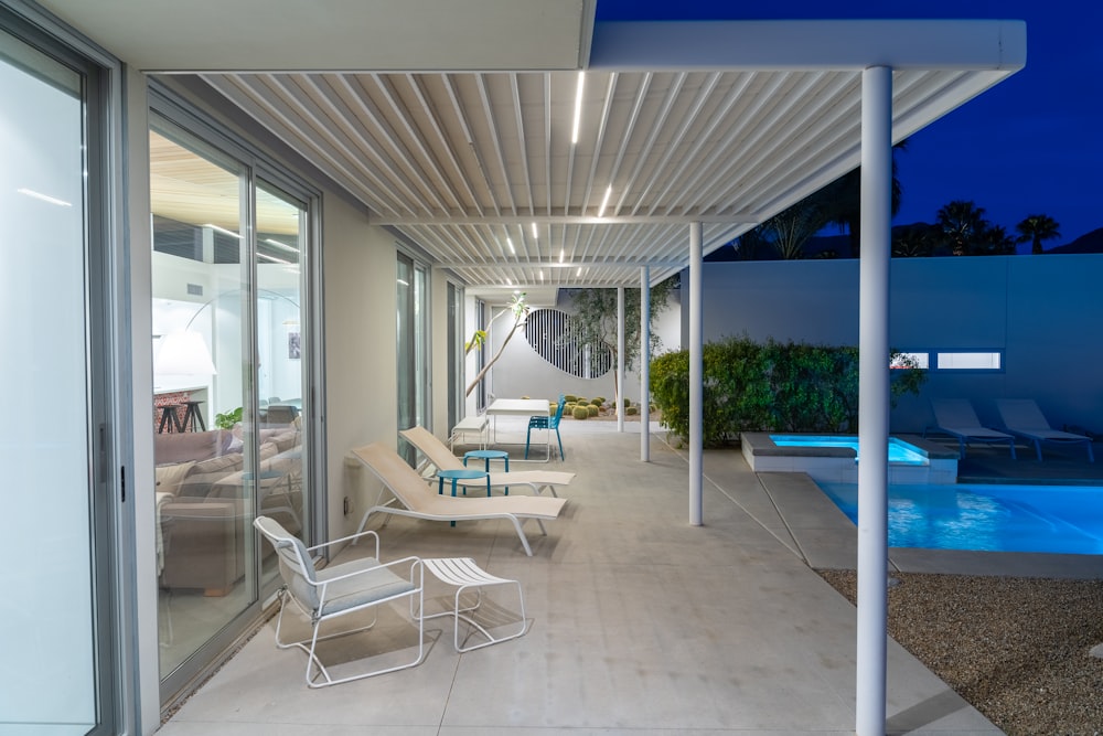 a modern house with a swimming pool at night