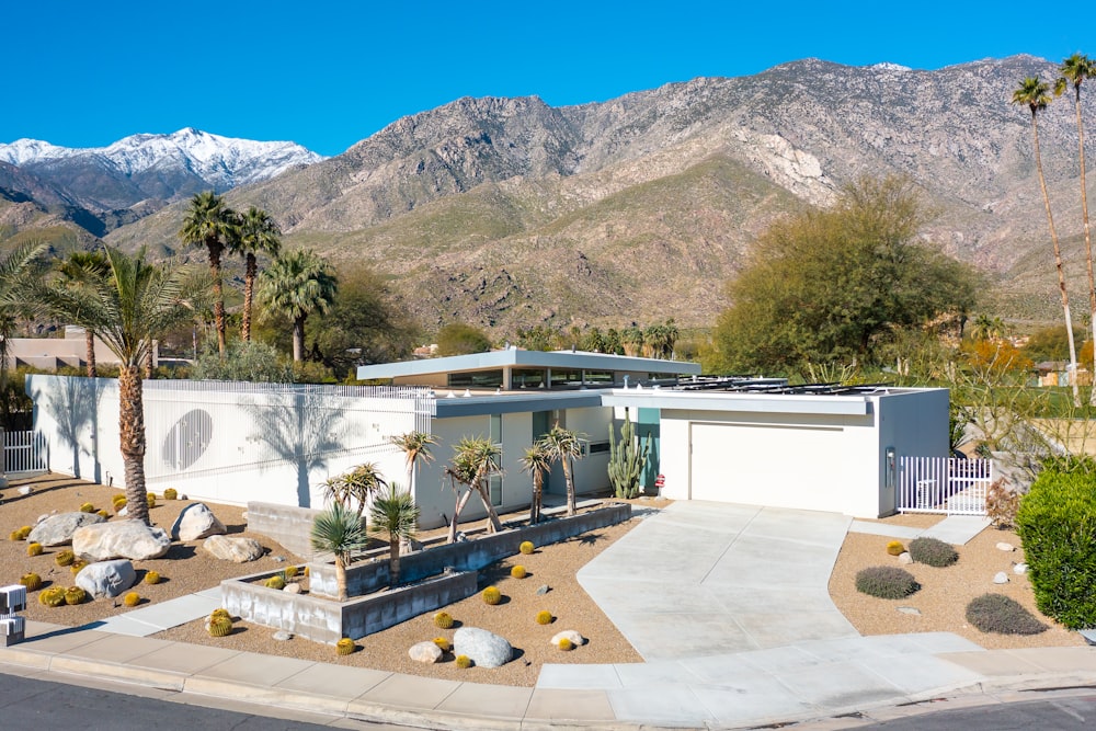 a house with mountains in the background