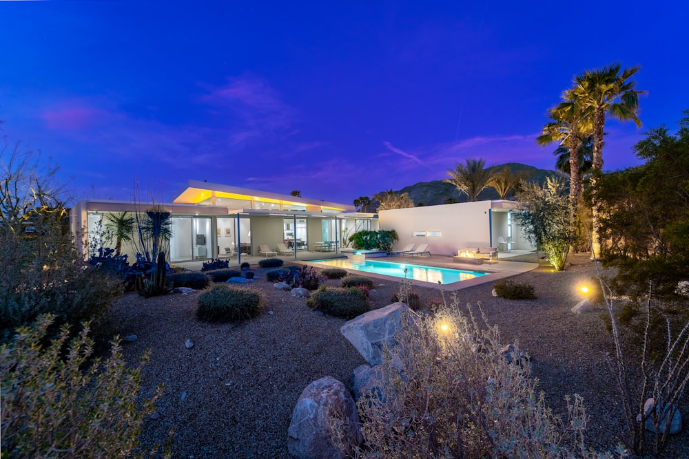 a house with a pool in the middle of it