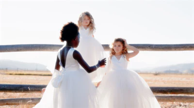 a group of young girls standing next to each other