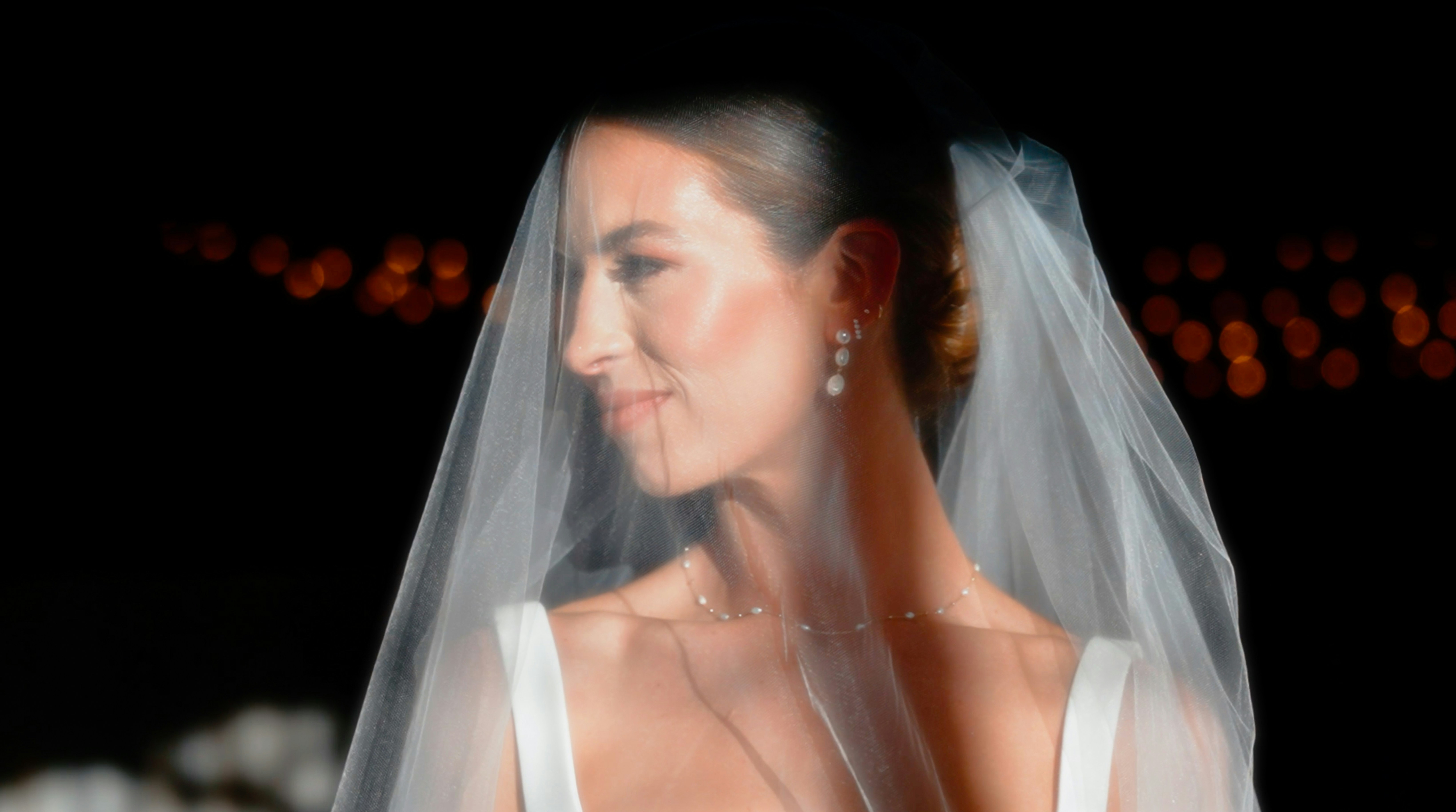 a close up of a woman wearing a wedding veil