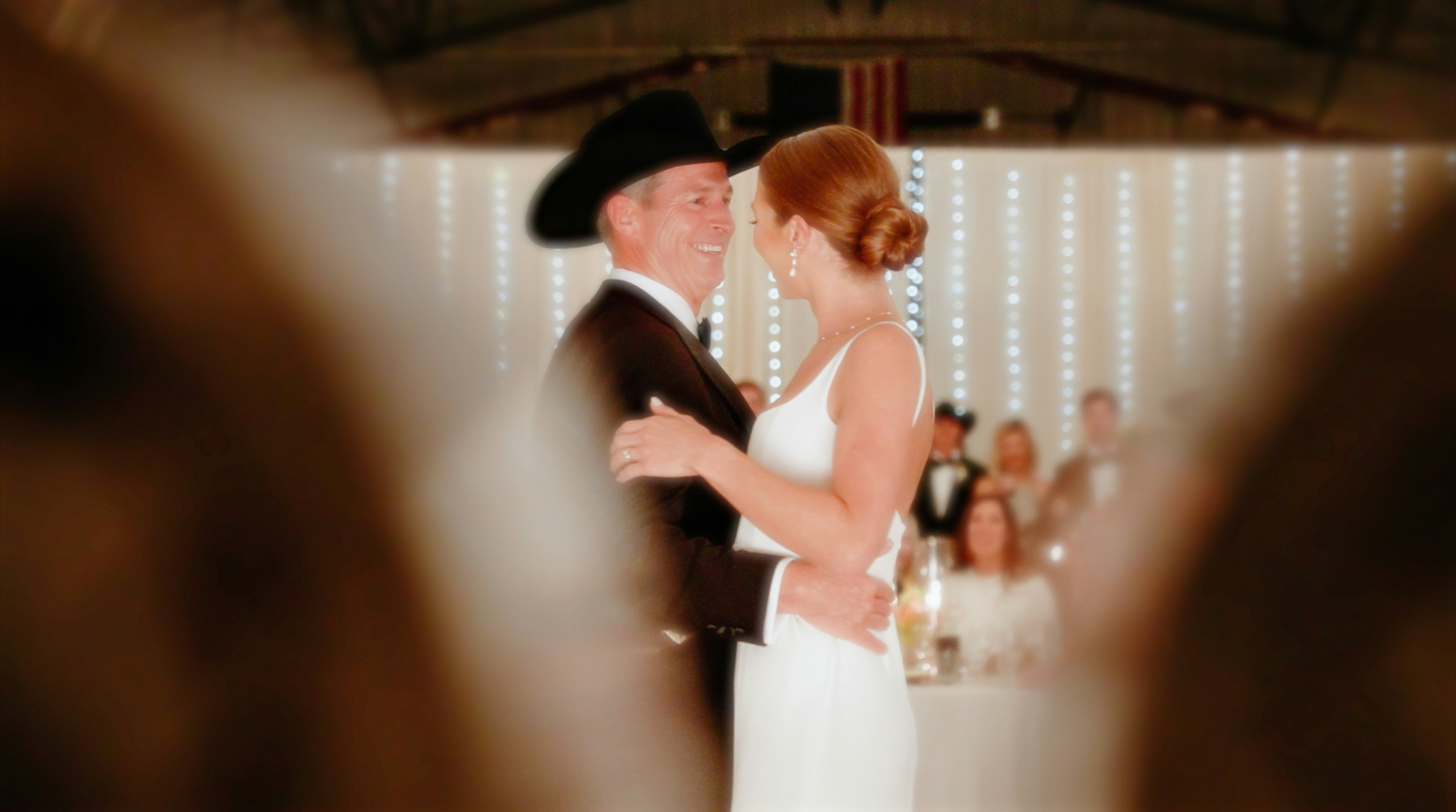 a bride and groom sharing a first dance