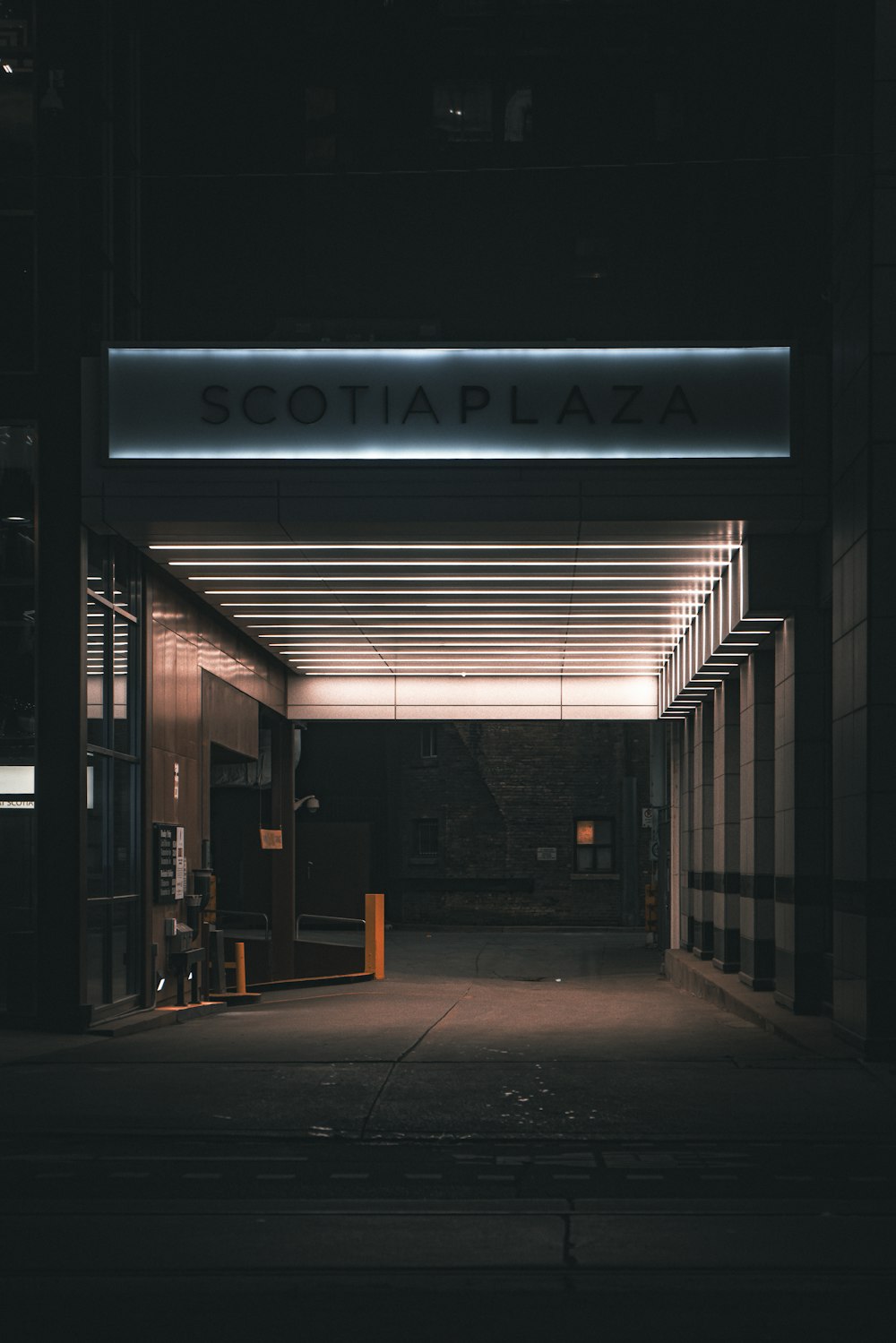 the entrance to a building lit up at night