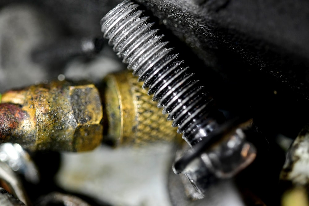a close up of a screw and a hose