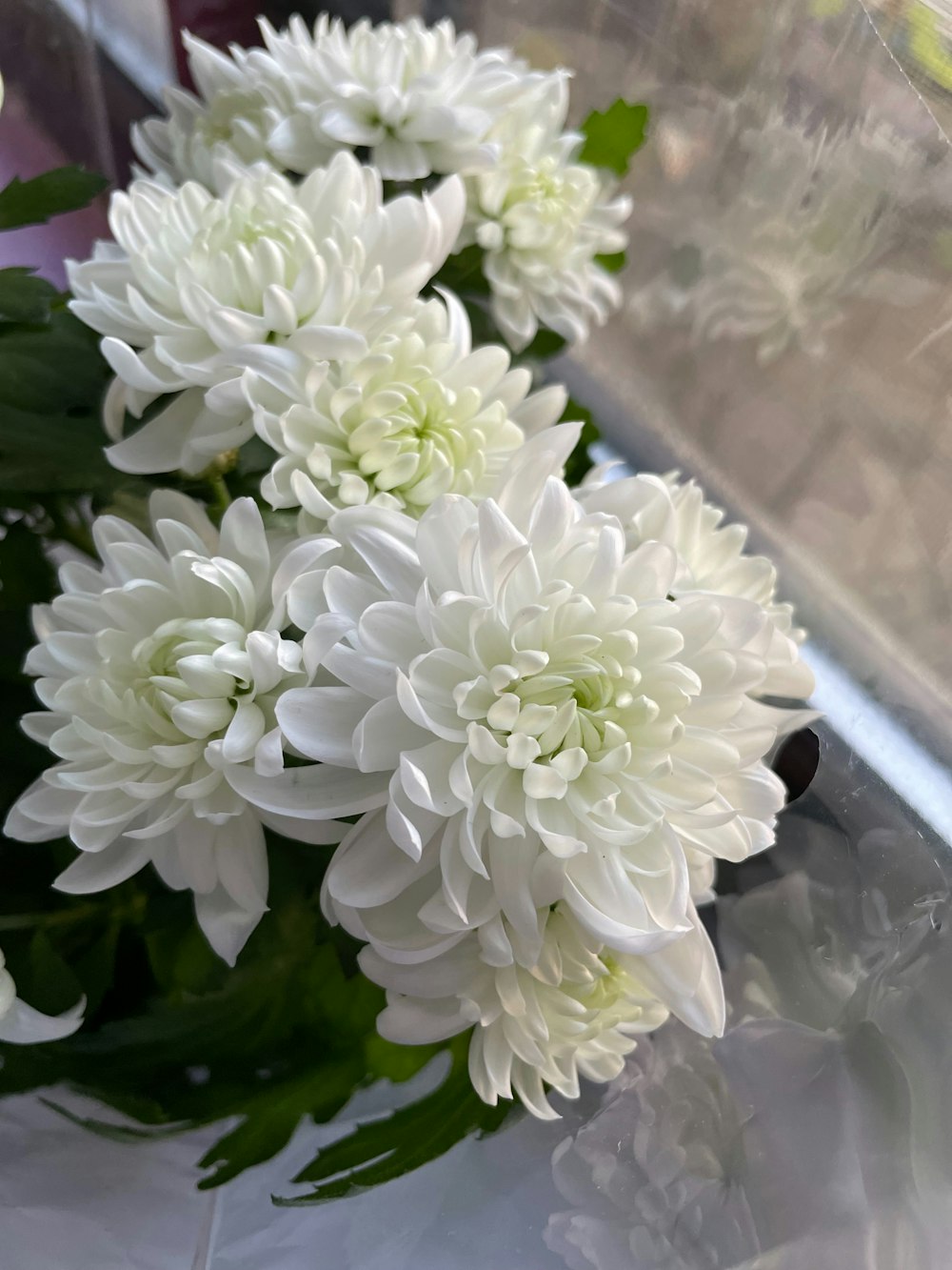 a bouquet of white flowers sitting on top of a table