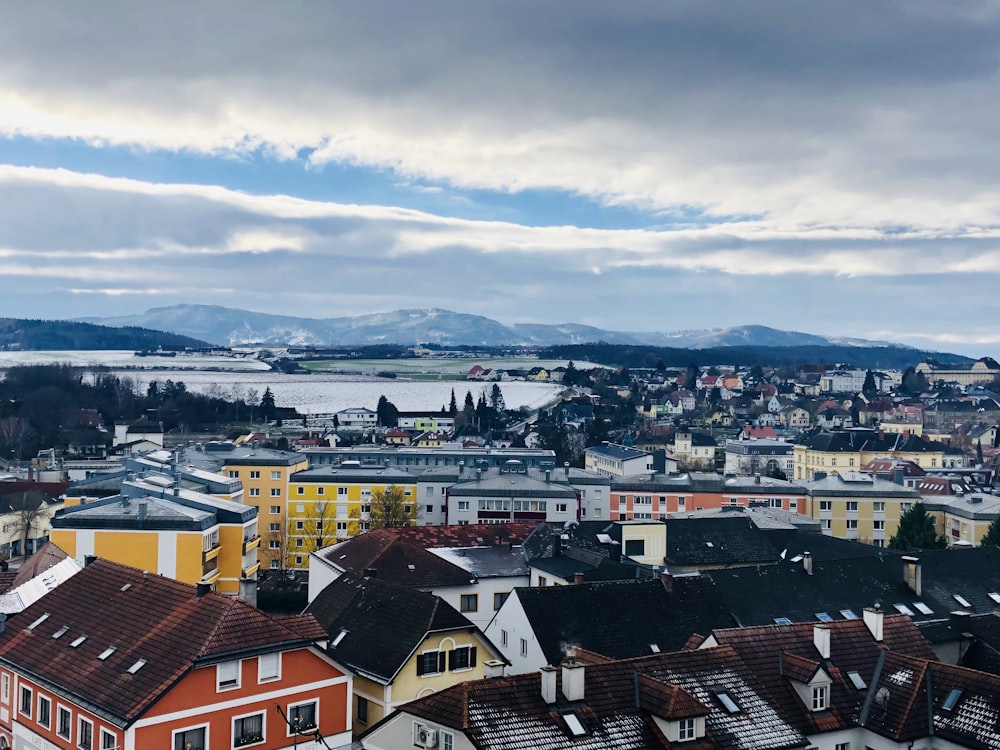 a view of a city with mountains in the background