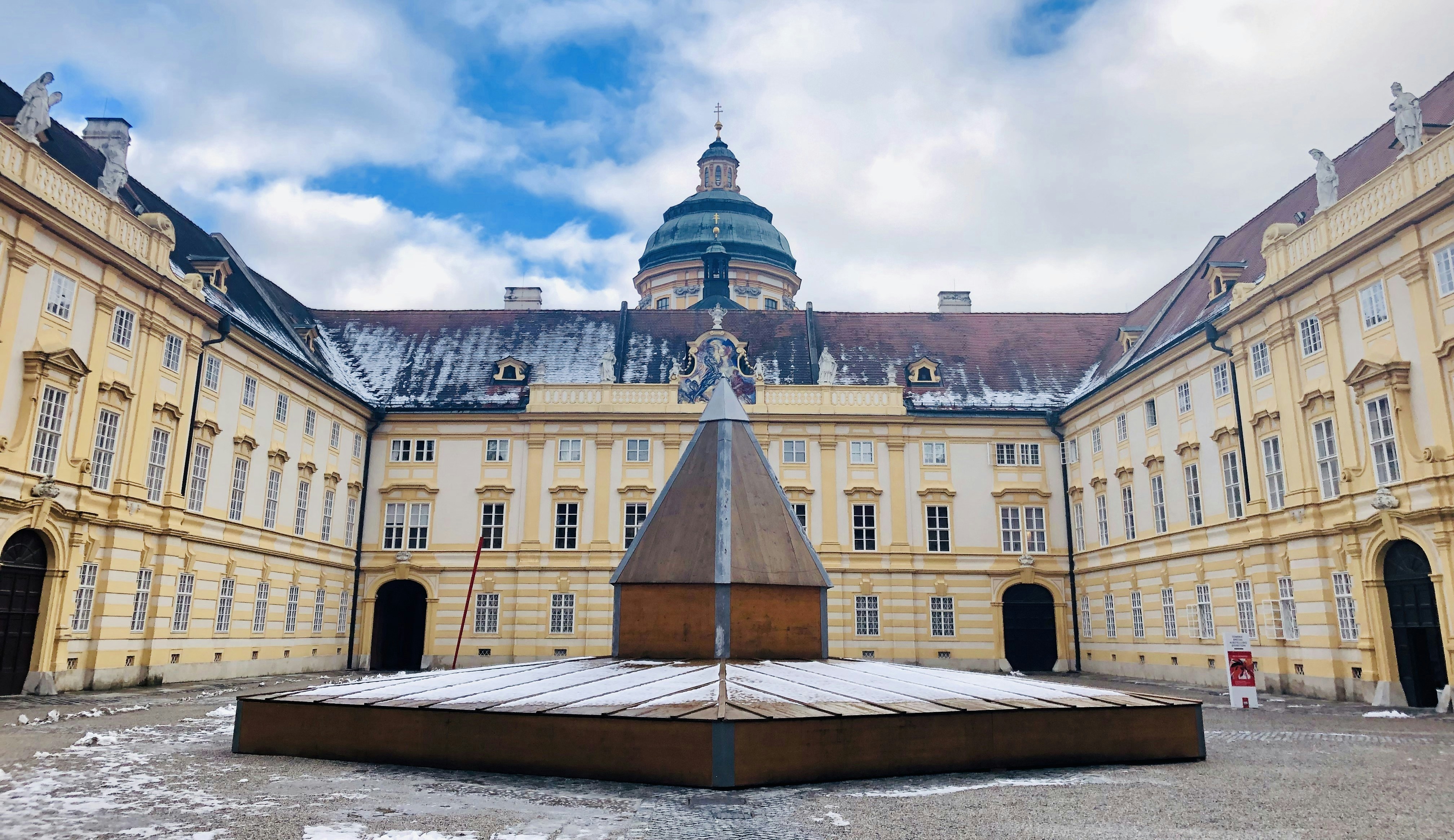 a large building with a clock tower in the middle of it