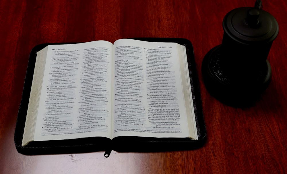 an open book sitting on top of a wooden table