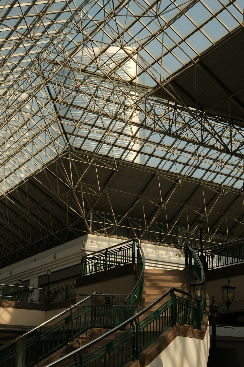 a building with a glass roof and stairs
