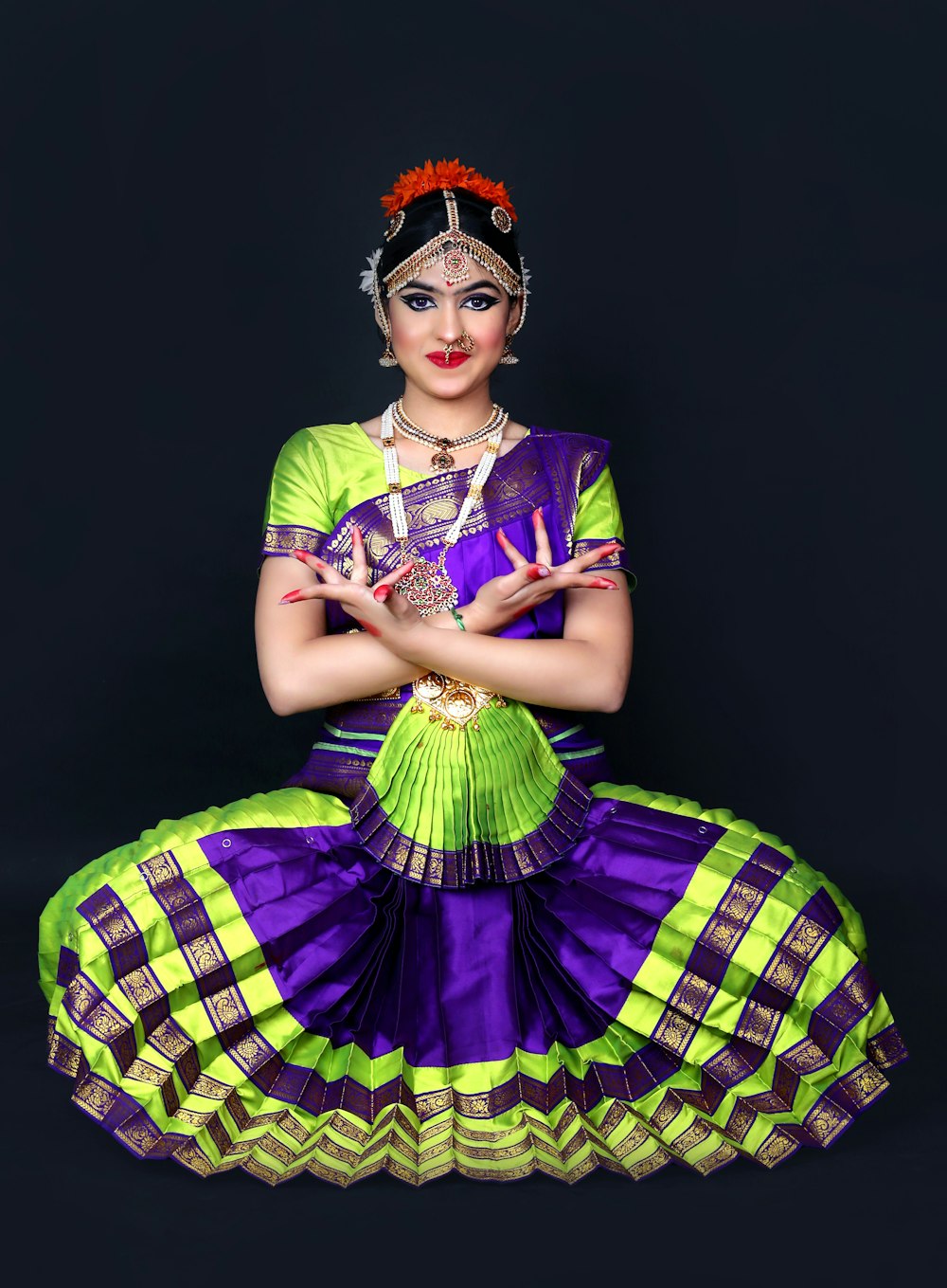 a woman in a purple and green outfit