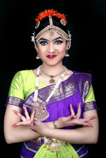 a woman in a purple and green outfit