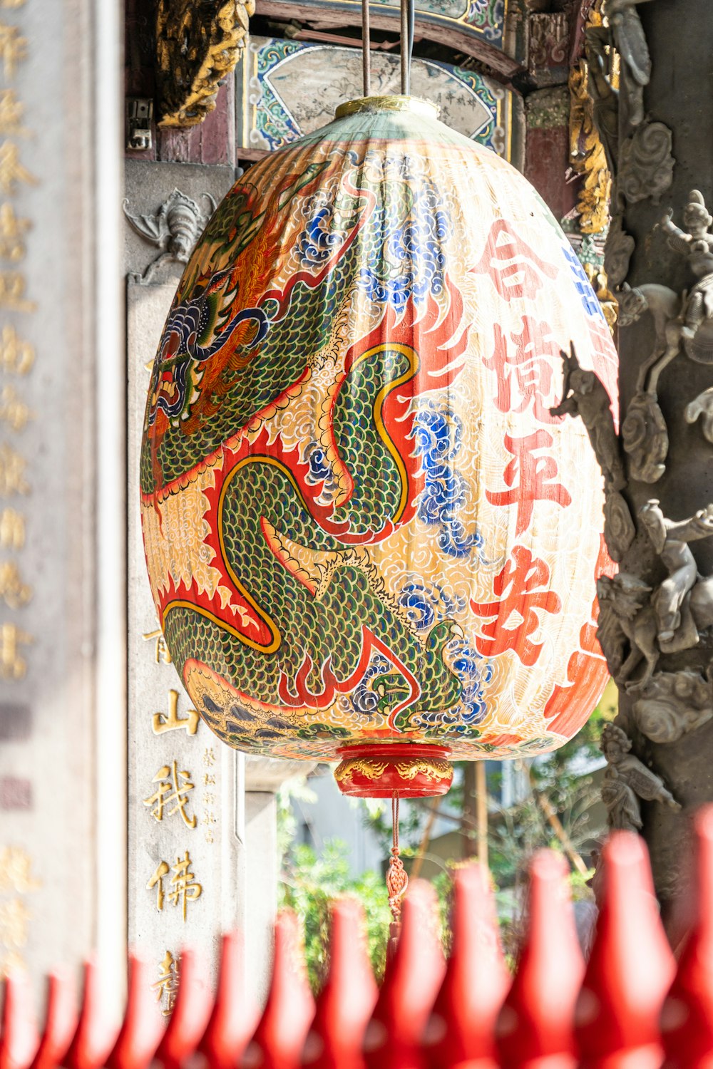 a chinese lantern hanging from the side of a building