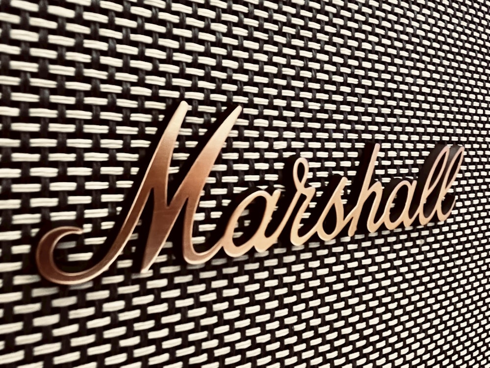 a close up of the word marshall on a wall