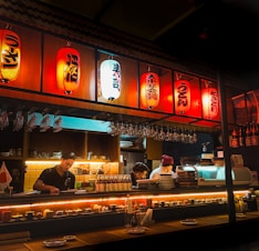 a restaurant with a lot of lights hanging from the ceiling
