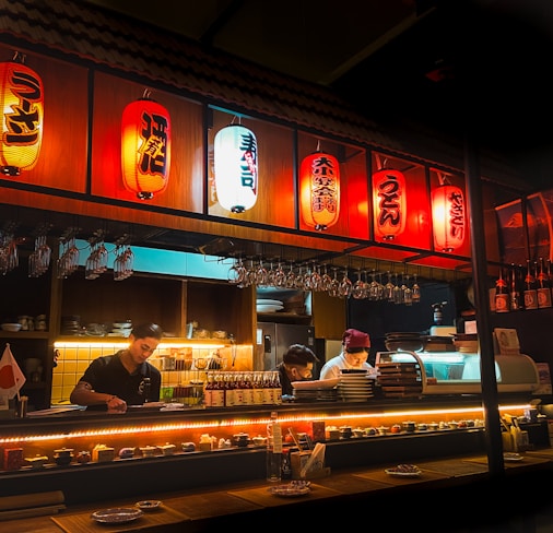a restaurant with a lot of lights hanging from the ceiling