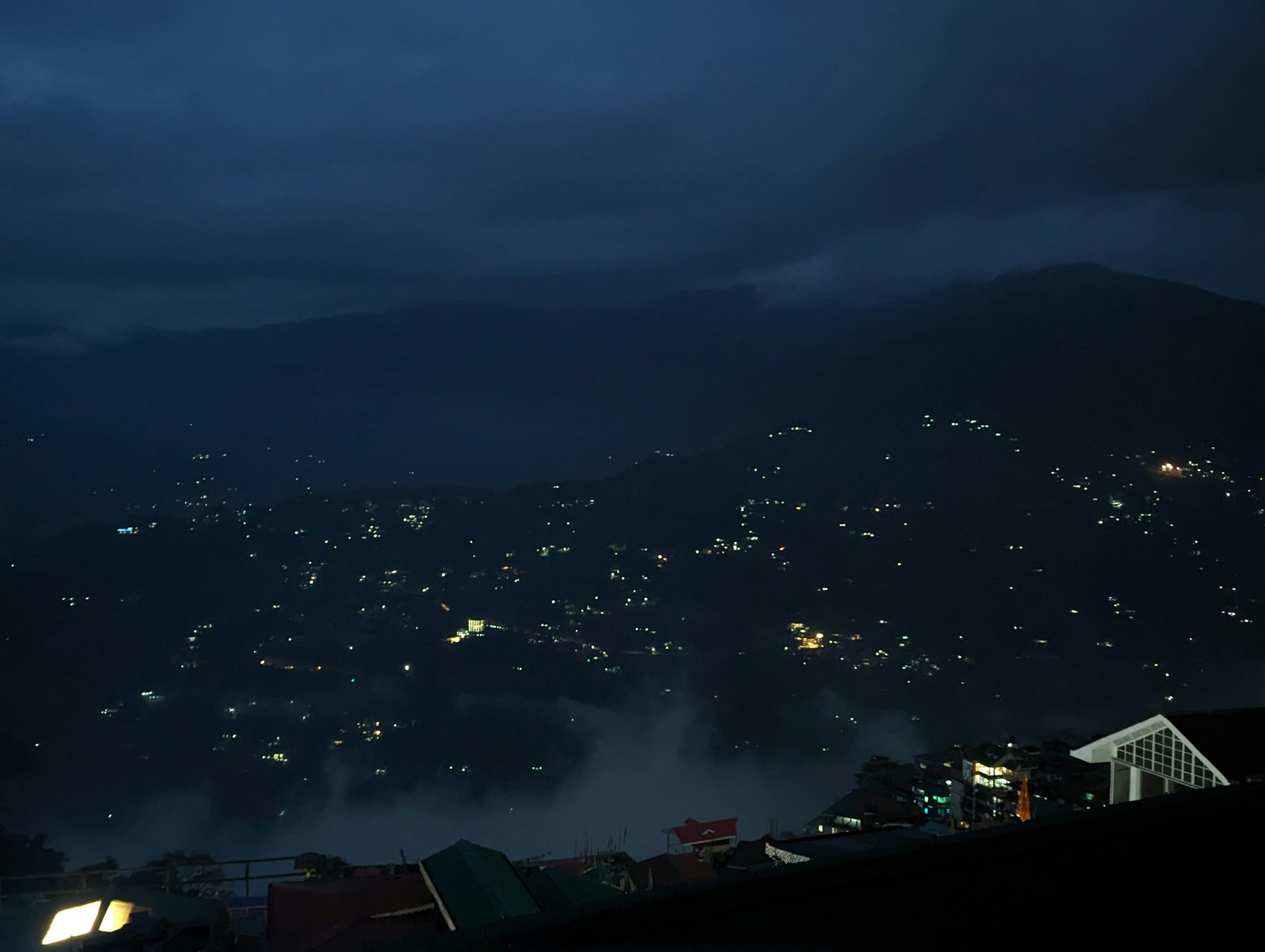 a night view of a city lights in the distance