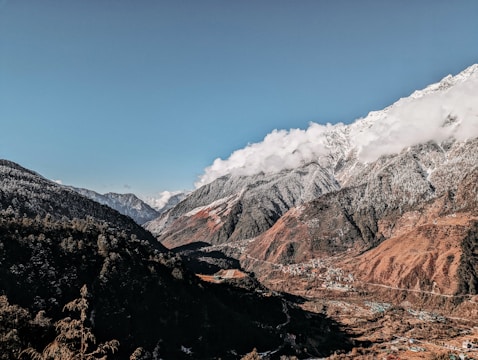 a view of a mountain range with snow on the top